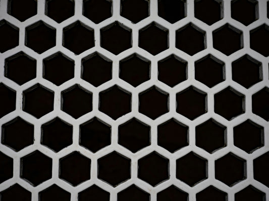 A white honeycomb pattern against a dark background
