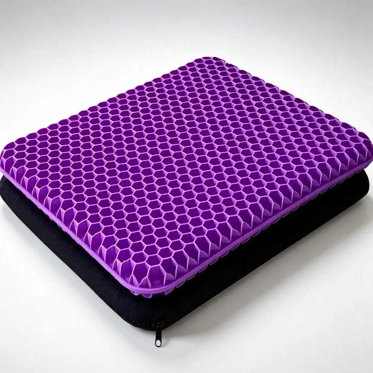 Rectangular purple honeycomb seat cushion pictured above a black zippered cover.