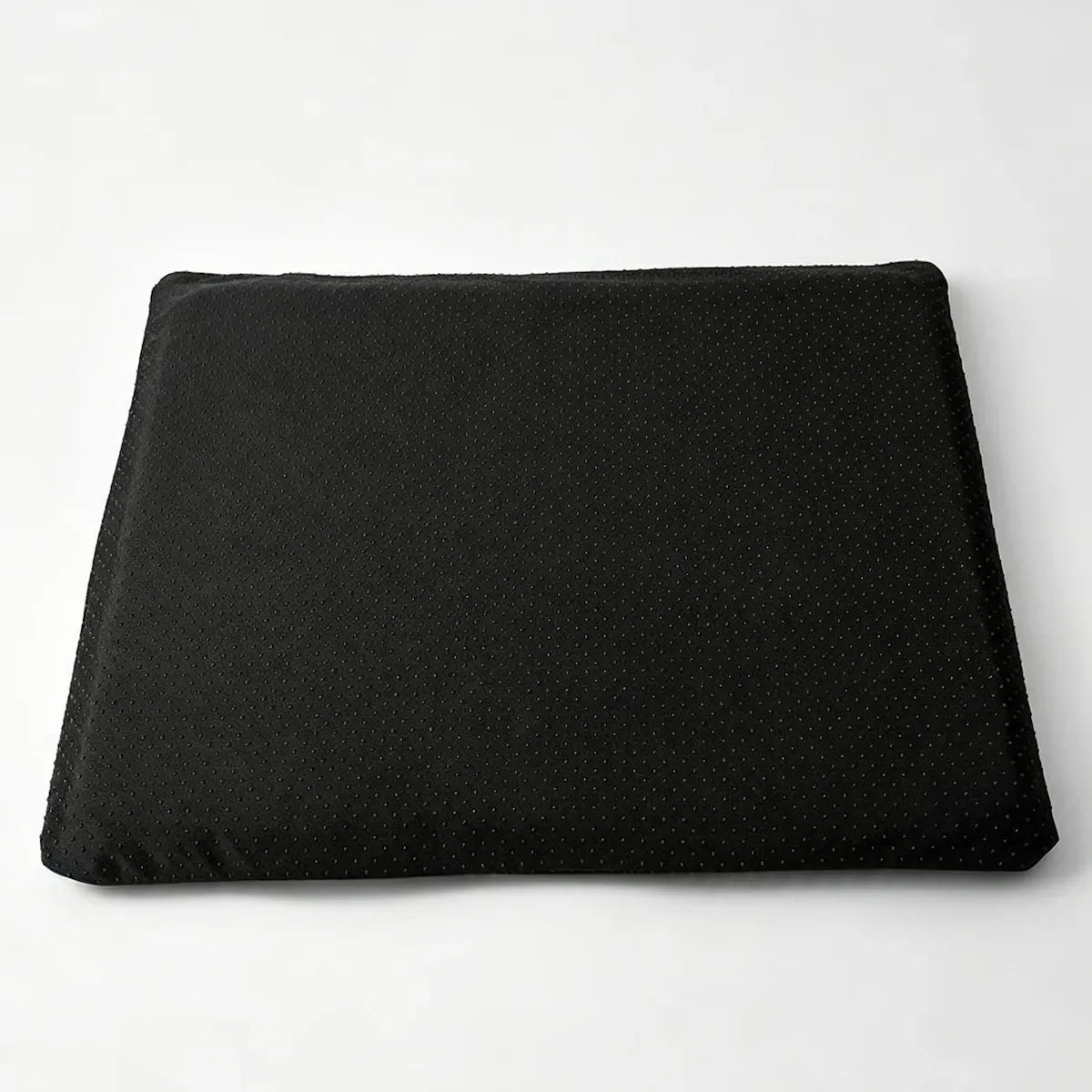 Black cushion cover on a white background.