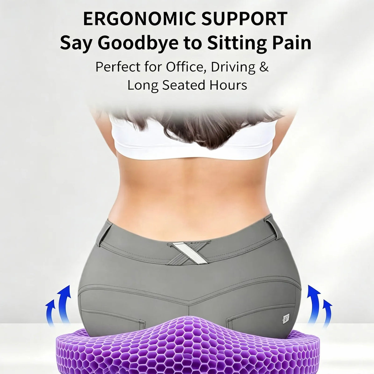 A person shown from the back wearing gray fitted shorts and a white sports bra, seated on a purple honeycomb ergonomic cushion with text above reading 'ERGONOMIC SUPPORT Say Goodbye to Sitting Pain' and blue arrows indicating support.