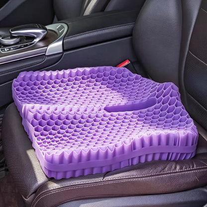 Purple honeycomb seat cushion with a central cutout on a car seat.