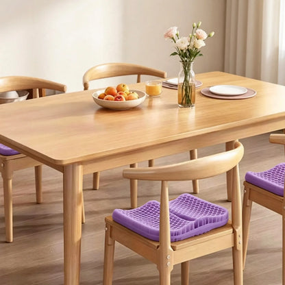 Purple honeycomb seat cushions on wooden dining chairs.