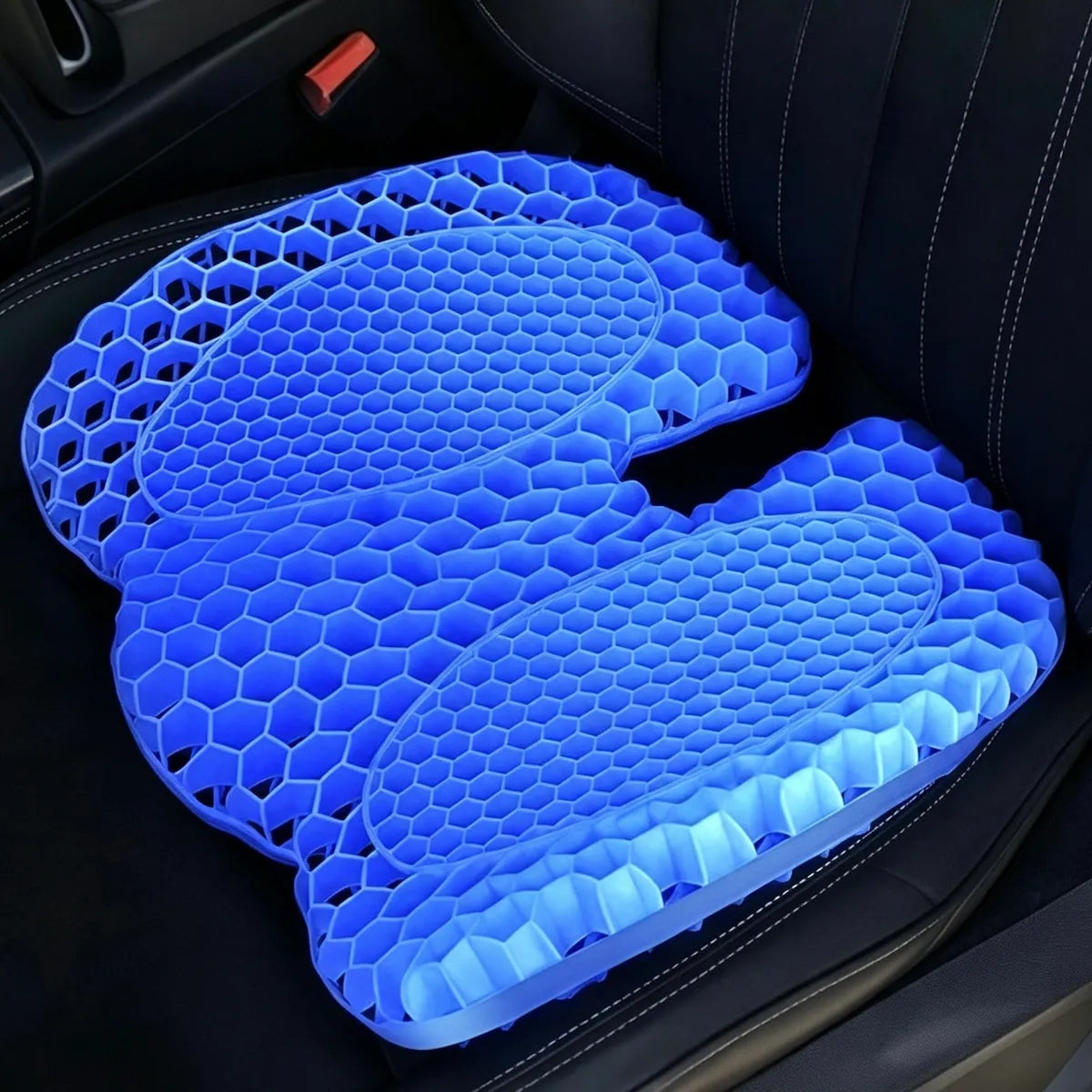 Blue contoured honeycomb TPE seat cushion shown on a car seat